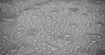 Close op of water sitting on top of a liquid waterproofing system