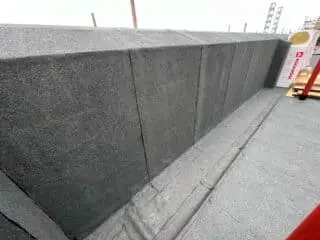 Membrane parapet wall waterproofing