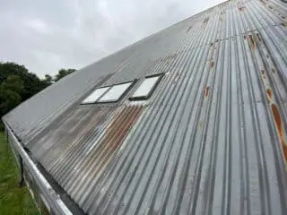 rusted metal clad roof with cut edge corrosion