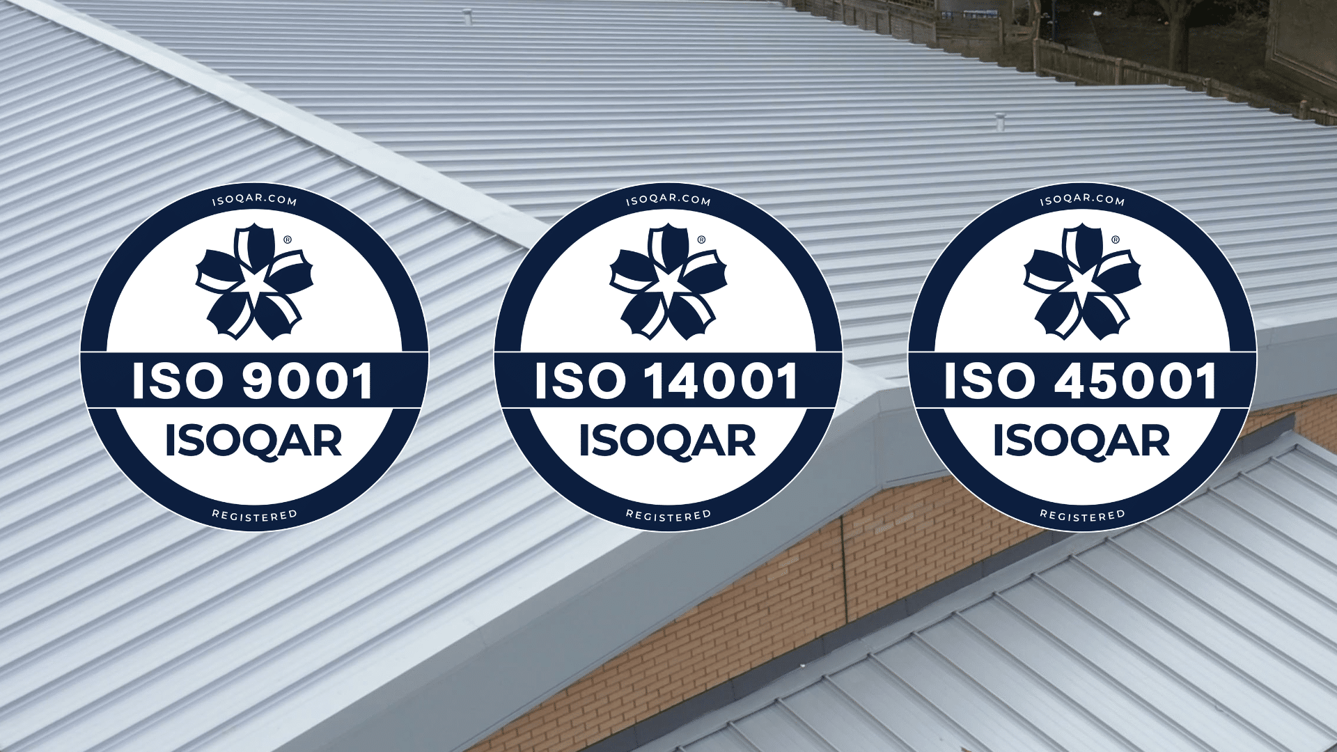 Graphic showing three ISOQAR certification badges for ISO 9001, ISO 14001 and ISO 45001 displayed over a background of a grey metal roof