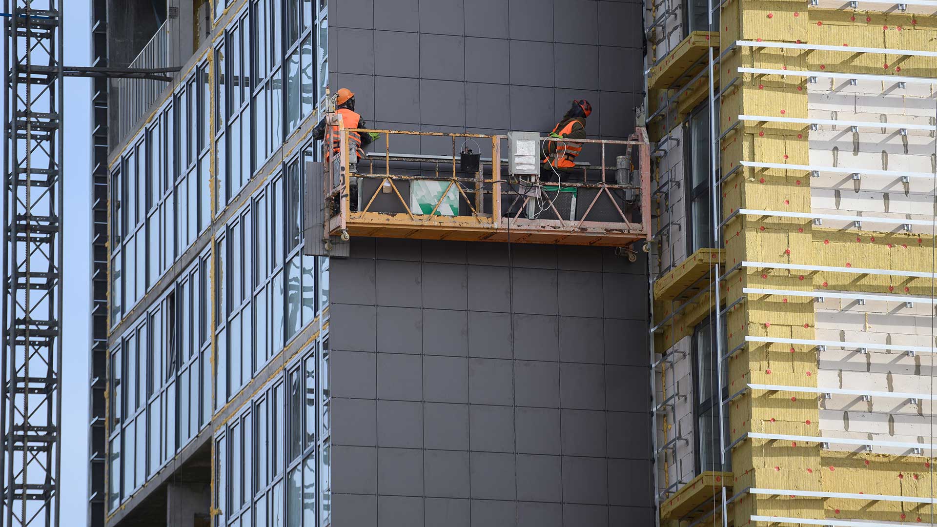 Retrofitting facade cladding system with insulation