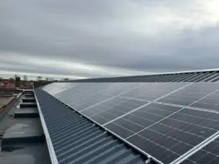 Metal cladding roof with solar panels