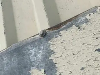 close up of blistering on metal roof sheet