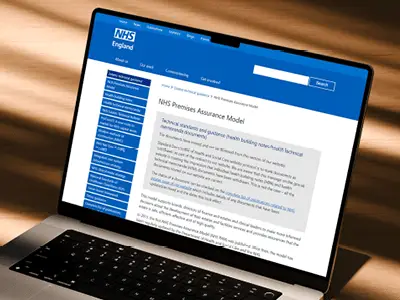 Laptop displaying the NHS Process Assurance Model page on the NHS England website
