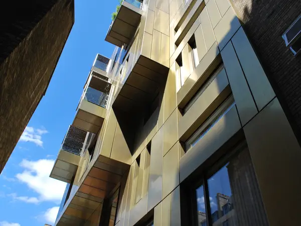 close up of gold colour rainscreen panel r-mer shield