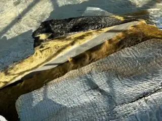 Storm-damaged roof at SC2 Water Park before replacement