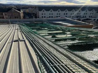 storm-resilient metal roofing, to be installed on the weather damaged leisure centre roof.