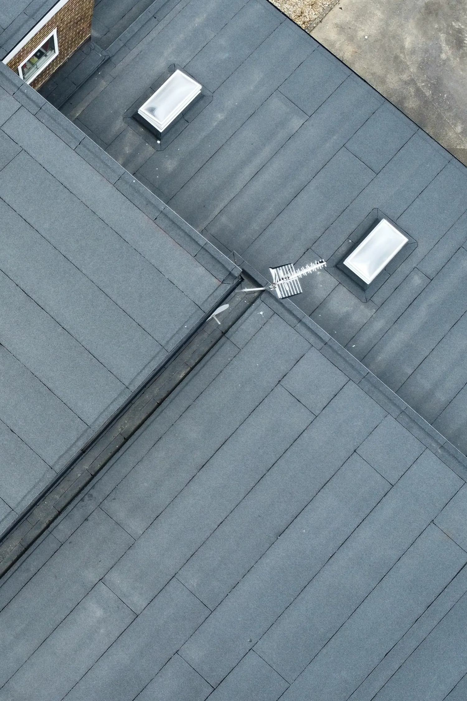Aerial view of flat roof with skylights and ventilation ducts installed