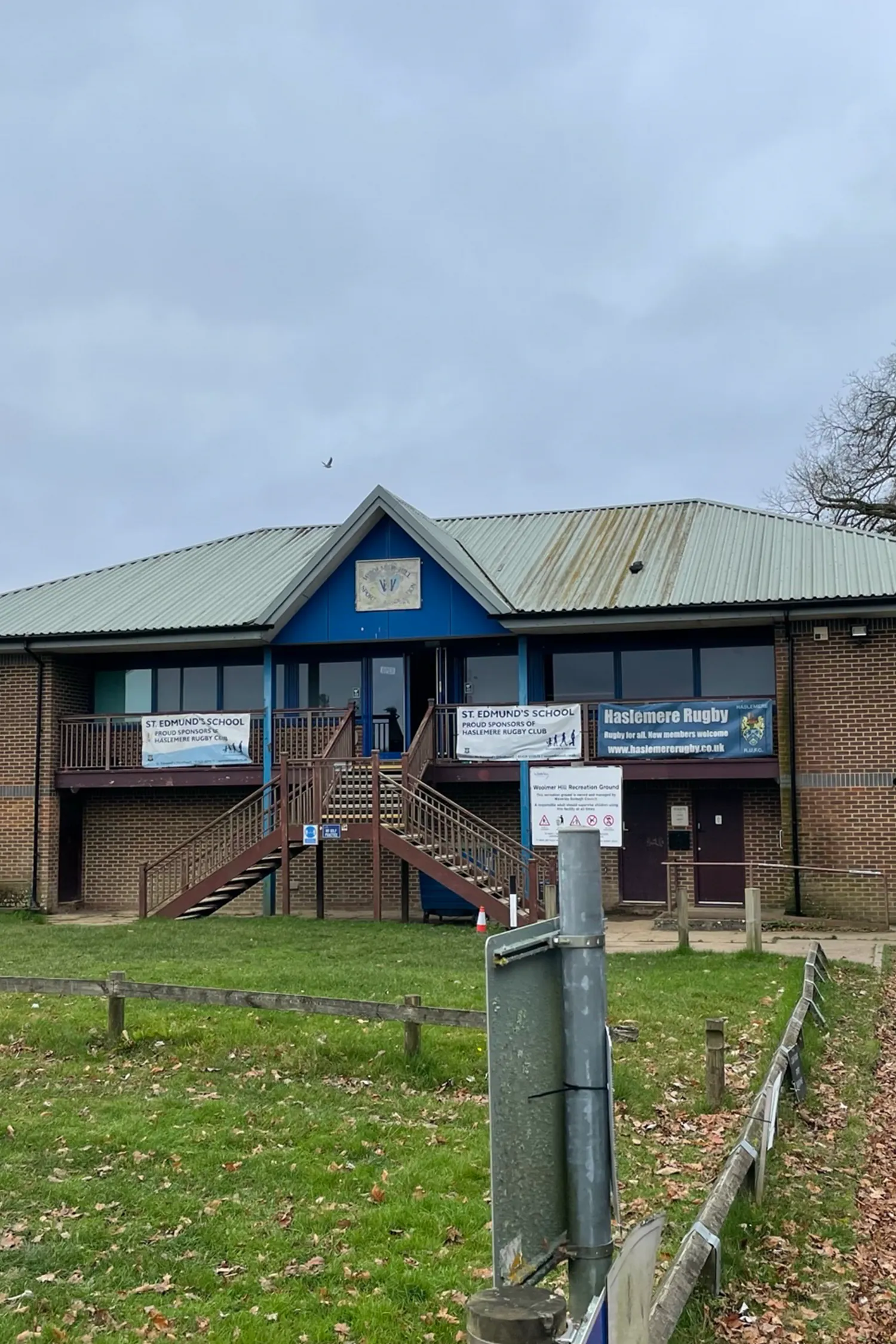 Haslemere Rugby Club building with blue gable and metal roof exterior