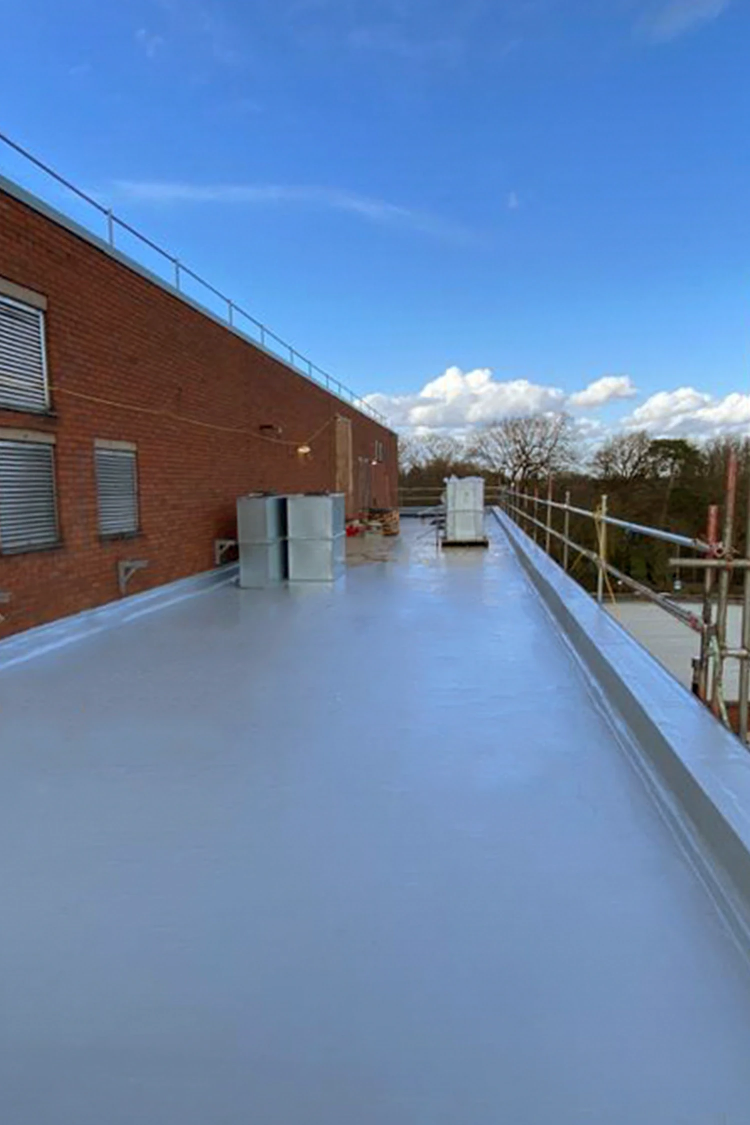 Newly waterproofed rooftop terrace at Queen Mary's Hospital with blue membrane coating