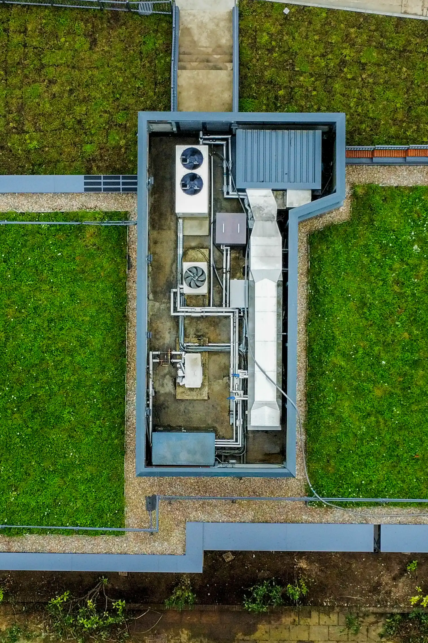 Aerial view of sustainable building with green roof and mechanical systems