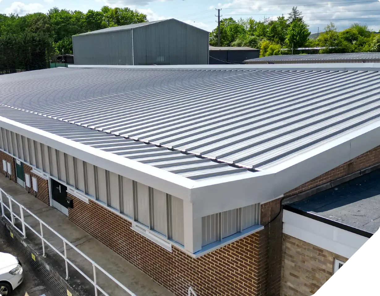 Standing seam metal roof refurbishment on brick building structure