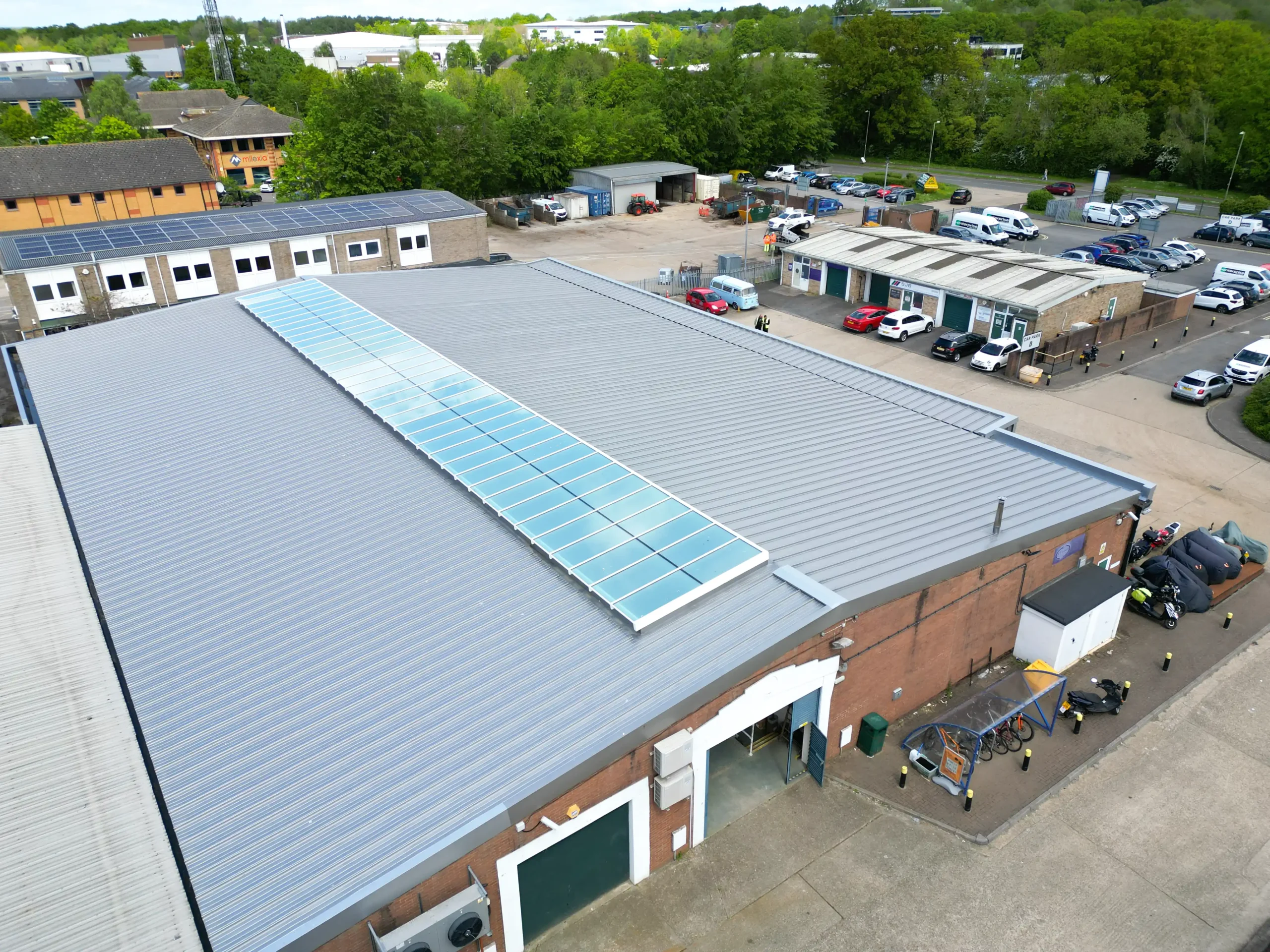 Aerial view of Beresford Centre industrial building with standing seam metal roof and solar panels