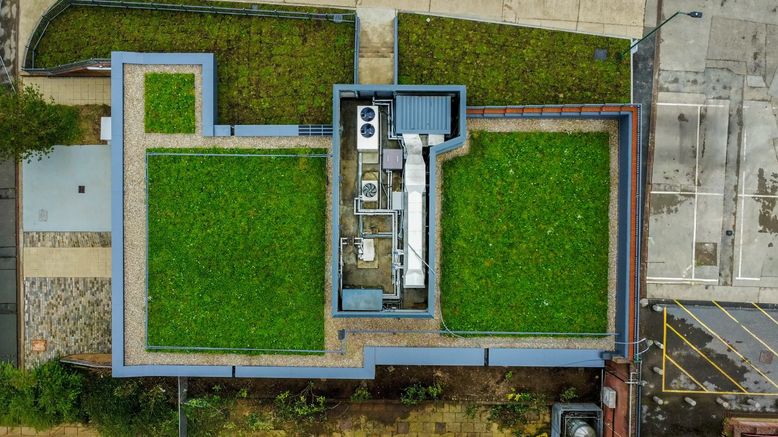 Aerial view of sustainable green roof covering modern university building structure