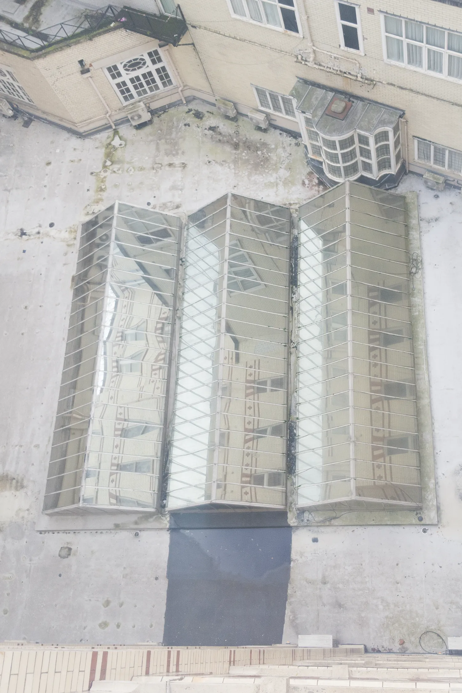Aerial view of Midland Hotel building with protective metal window guards